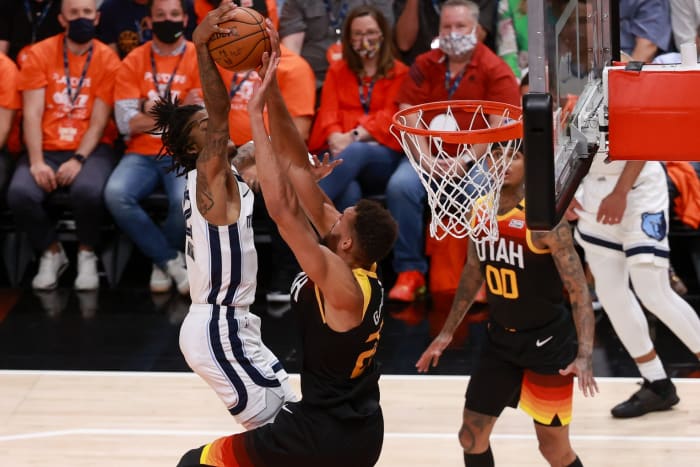 Rudy Gobert (27) rejects a dunk attempt by Ja Morant (12)